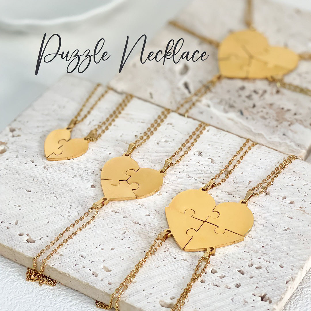 Gold puzzle necklace set that fits together for friends or couples